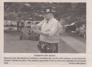 Illusionist Jim Macdonald busking at the Lancaster Farmers' Market.